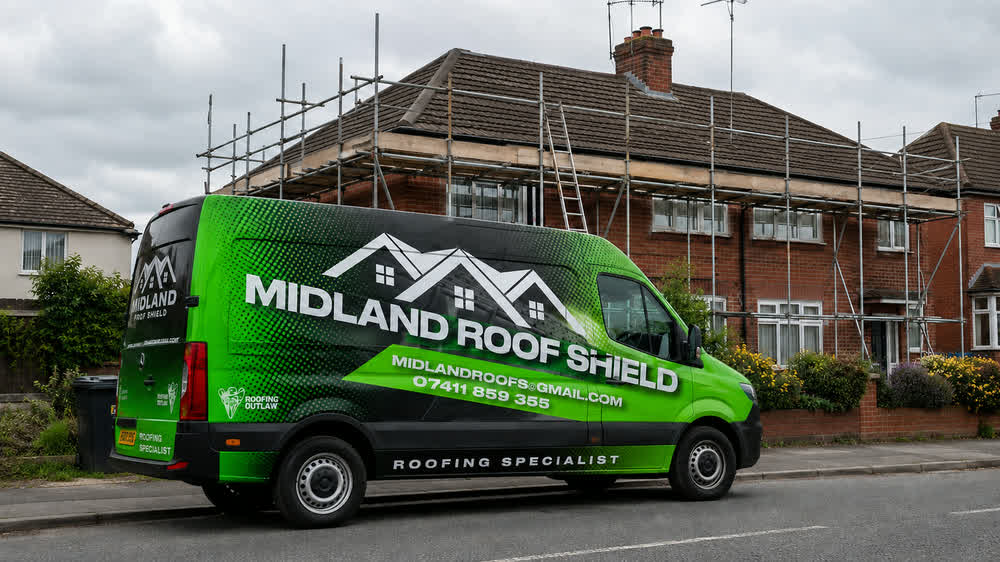 The Midland Roof Shield van parked outside a scaffolded house