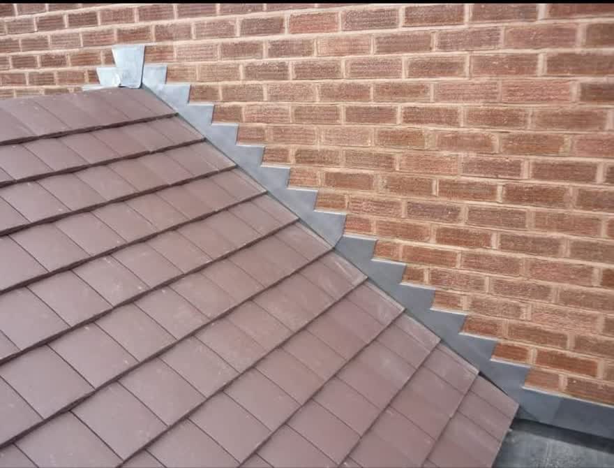 Tiles cut and dressed neatly into a brick abutment wall